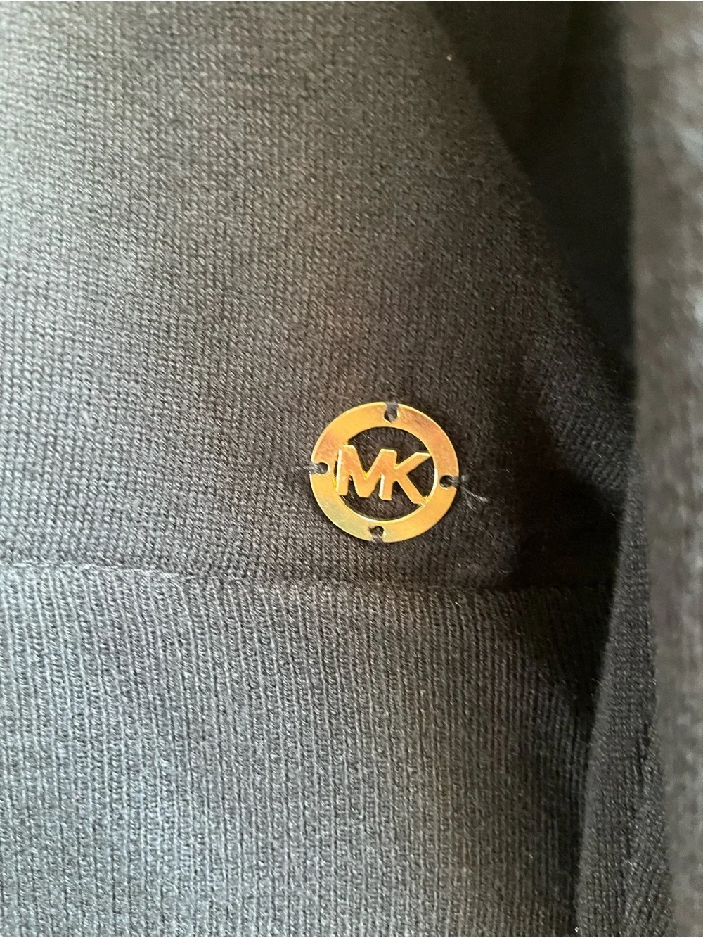 New w/tags, Michael Kors top w/silky shirt tail in black. Size L w/gold logo.